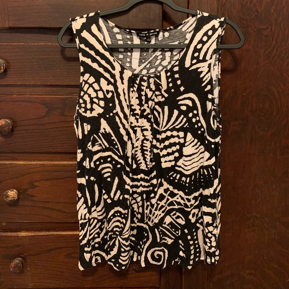 Sleeveless black and off-white blouse